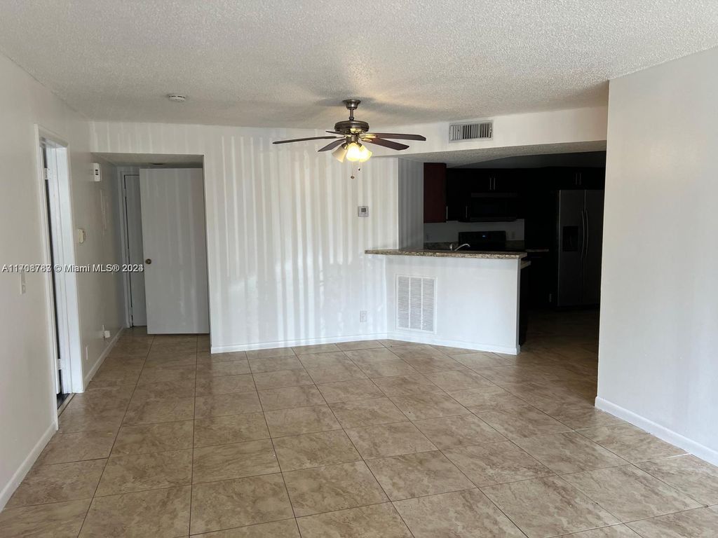Photo of 8741 Wiles Rd #103, Coral Springs, FL 33067 (MLS # A11708783)