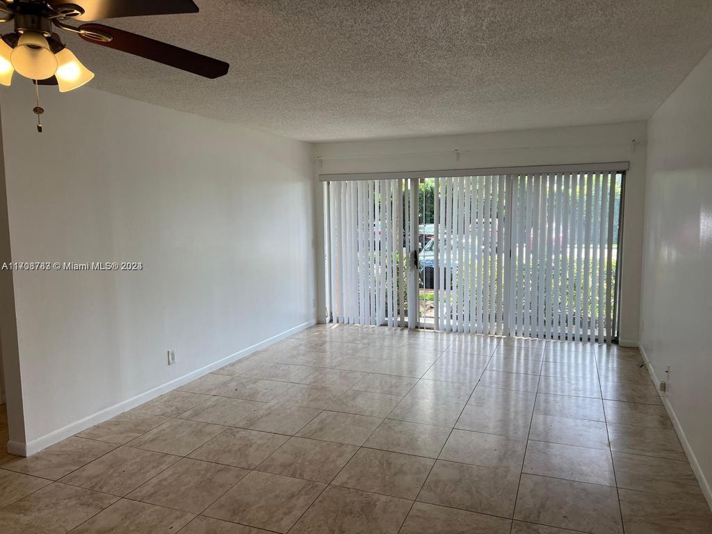 Photo of 8741 Wiles Rd #103, Coral Springs, FL 33067 (MLS # A11708783)