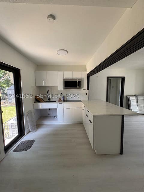 Tiny photo for 811 NW 65th St, Miami, FL 33150 (MLS # A12041652)