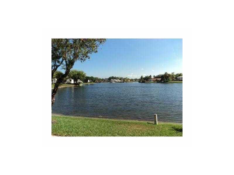 Beautiful water front Townhome located in a wonderful neighborhood with 24 off duty Hollywood Police patrol, community playground, and enclosed dog-park. Residence is conveniently located near shopping points of interests as well as places of worship. Lar ge square footage includes sufficient storage space, as well as a spacious front and back patio.