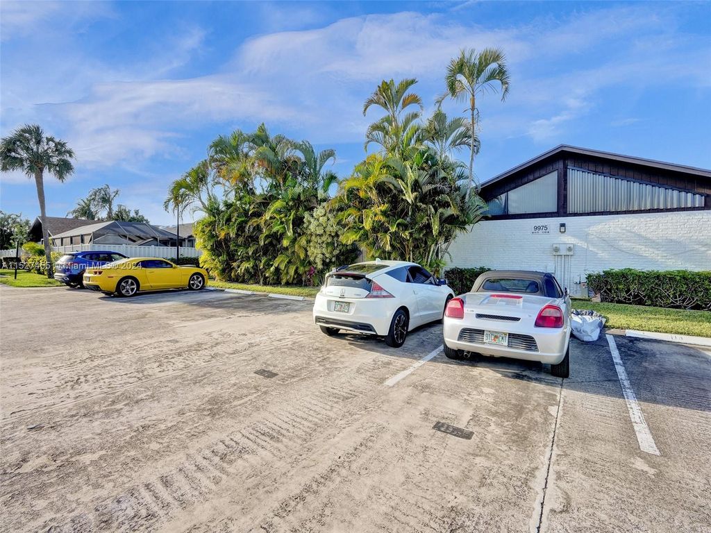 Photo of 9975 Boca Gardens Trl #D, Boca Raton, FL 33496 (MLS # A11527455)