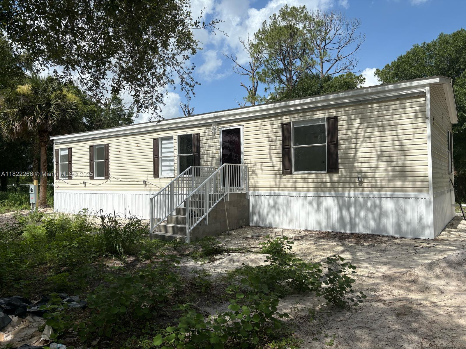 Amazing Modern Pre-Fabricated Home with high quality interior design and appliances. This includes 3 bedrooms, 2 full bathrooms, wall to wall tiles, a covered porch, and a motorized gated entrance to the property. This is not only a house, but also styled as a modern farm! Plenty of space to park Boats, Trailers, even commercial vehicles... there is plenty of space to accommodate.