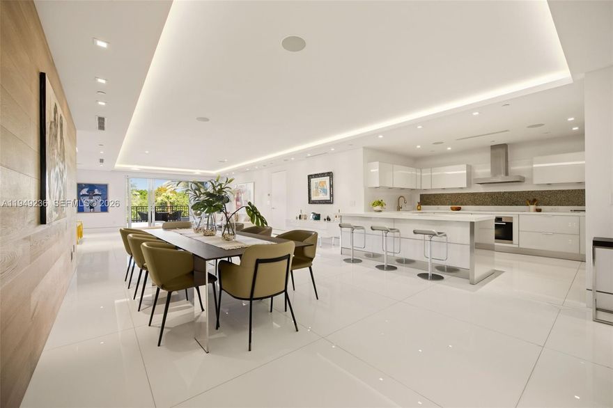 Visionary design and innovative craftsmanship define this ultra-luxurious residence at the exclusive Residences at Vizcaya, an intimate collection of only 18 homes set along the picturesque Biscayne Bay in Coconut Grove. Offering the timeless appeal of waterfront living with a relaxed, modern aesthetic, this residence delivers privacy, tranquility, and a seamless balance of form and function.
The thoughtfully designed open floor plan features two bedrooms, two-and-a-half baths, and expansive living spaces filled with natural light streaming through a covered balcony overlooking lush garden views. Upon arrival via a private keyed elevator, the residence reveals calming neutral tones complemented by bespoke finishes throughout, including Miacucina Italian glass cabinetry in the kitchen and closets, Miele stainless steel appliances, 48x48 white glass flooring, custom oak wood accent walls, Lutron lighting, and a fully integrated audiovisual system. Every detail has been curated to reflect understated elegance and refined simplicity. Residents enjoy a boutique lifestyle with resort-style amenities, including an infinity-edge lap pool with dual spas, cabana areas, and a marina directly on the bayfront. The residence includes two covered parking spaces with a parking lift accommodating a third vehicle. Ideally located minutes from Downtown Miami, Brickell, and Coral Gables, this is a rare opportunity to experience gracious service, unparalleled luxury of waterfront living.