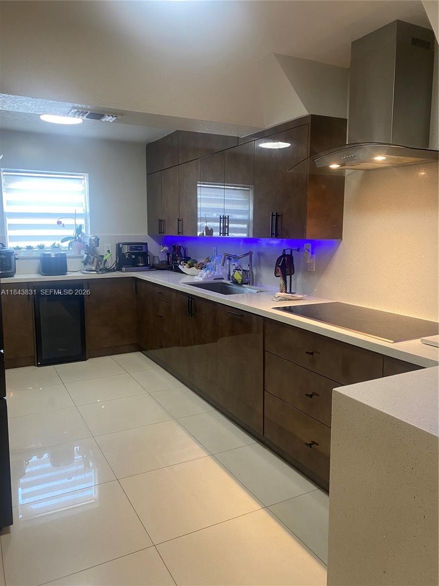 INCOME PROPERTY!!!  FEATURES A RENOVATED KITCHEN , UPDATED FLOORS AND DOORS. CALIFORNIA CLOSETS A SALTWATER POOL, AND A BACKYARD WITH CANAL ACCESS- PERFECT FOR JET SKI. INCLUDES A WATER PUMP SYSTEM THAT DRAWS WATER FROM THE CANAL TO IRRIGATE THE LAWN TROUGH THE SPRINKLERS.  EASY TO SHOW.