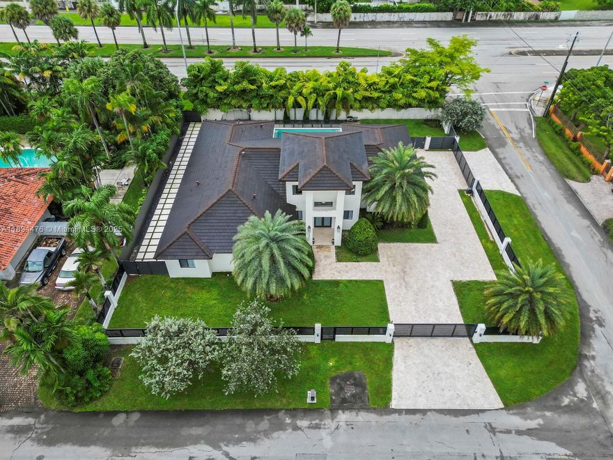 One of a kind 5 BR, 4 bath modern home for sale in the heart of Kendall. Impeccably designed w/ an open concept layout, ideal for entertaining. Fall in love w/ the cathedral ceilings and beautiful pool view from the moment you step foot through the front doors. Spacious kitchen featuring custom European cabinets, suede granite counter tops, Monogram kitchen appliances, a gas stove, an oversized walk-in pantry & a custom, glass wine display case. Luxurious master BR & bath with a soaking tub, rain showers & double walk-in closets. House is fully equipped with impact glass throughout, built out closets, custom recessed lighting & an alarm/camera system. Maids quarters & laundry room. Large covered patio area w/ surround sound over looking the saltwater pool. Selling furnished is an option.