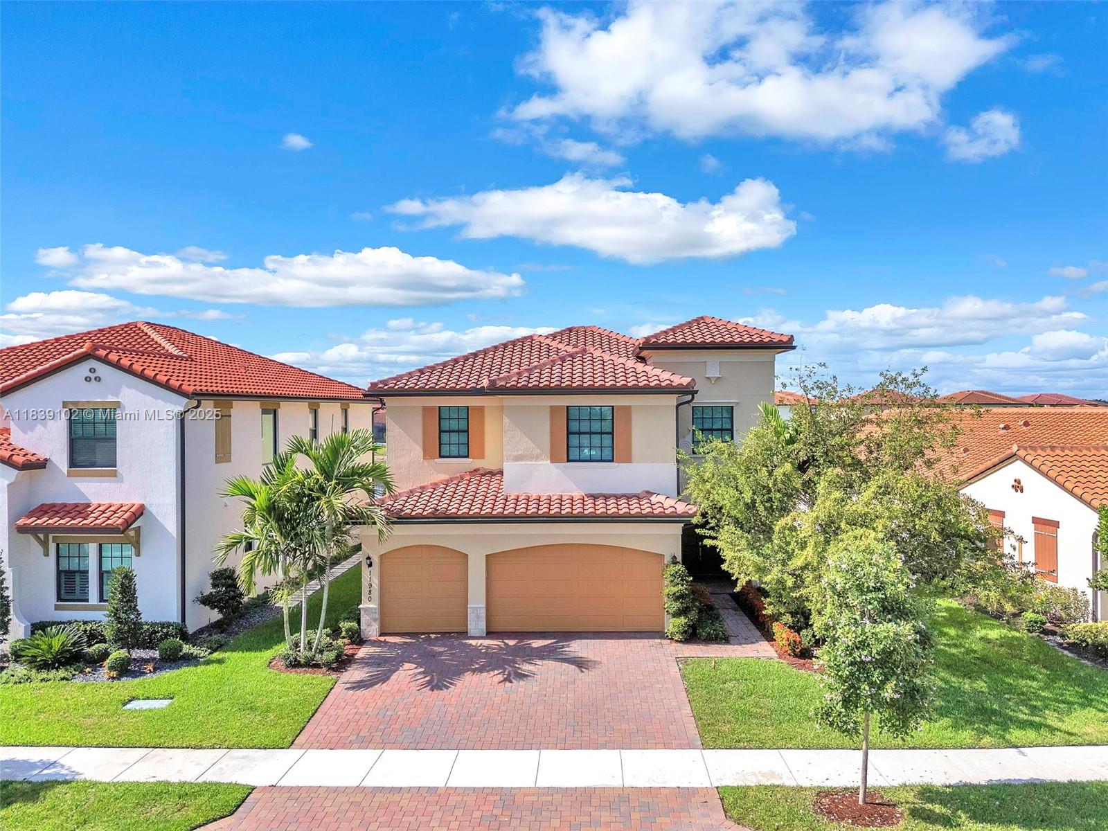 Stunning waterfront living in Parkland’s premier Parkland Bay community! This upgraded home features five bedrooms and four bathrooms with soaring 21-foot ceilings. Enjoy breathtaking waterfront views from the covered patio and take in the evening breeze—a true indoor/outdoor Florida lifestyle. Delight guests in the luxurious gourmet kitchen, elegant dining room, and ample family room, all tailor-made for seamless entertaining. Hurricane impact windows throughout. Enjoy resort-style amenities ranging from a lavish pool and gym to a clubhouse and basketball/tennis courts. The community also features tree-lined sidewalks for strolls with the family. Zoned in an A+ school district, Parkland has easy access to shops, restaurants, and nine spectacular parks. Make this your dream home!