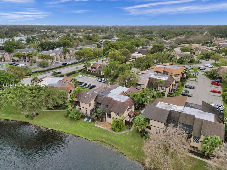 HUGE PRICE REDUCTION!! Beautiful and fully renovated   single family townhouse that is NOT in a "condo" association!  5% MINIMUM DOWN NEEDED! Brand new Roof,brand new wood flooring,updated bathrooms.This house has lovely lake view with huge patio and balcony on second floor.No application process or application fee!! Small monthly fee includes cable..Upstairs,three bedrooms with private balconies and two and half elegantly updated bathrooms.This house is steps from pool.. Enjoy seamless indoor-outdoor transitions with sliding doors that lead from the living room to a tranquil patio.Close to great schools!Take advantage of nearby playground, pool,basketball court!The unit boasts one of the largest floor plans in the community as well as having a water front view.schedule your showing today.