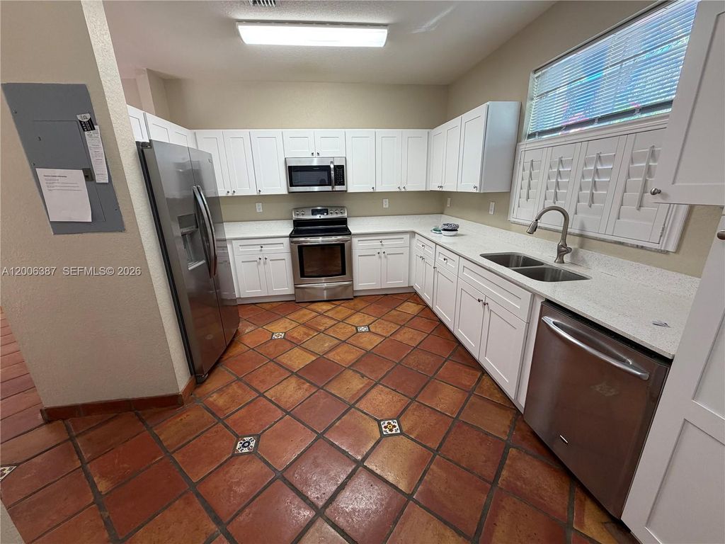 Photo of 941 Doveplum Ct, Hollywood, FL 33019 (MLS # A12006387)