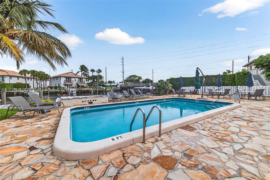 Photo of 199 E Mcnab Rd #101, Pompano Beach, FL 33060 (MLS # A12110109)