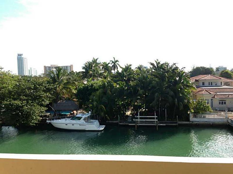 THIS APARTMENT HAS IT ALL :  REMODELED 1 BED, BALCONY, ASSIGNED SECURED PARKING, SWIMMING POOL, VIEW ON THE CANAL AND ALL MID-BEACH. ONE BLOCK FROM 41 STREET SHOPPING AND TRANSPORTATION IN MIAMI BEACH. VERY QUIET, READY TO MOVE-IN.  THIS IS RARE, WON T LA ST.  No Pets Allowed.