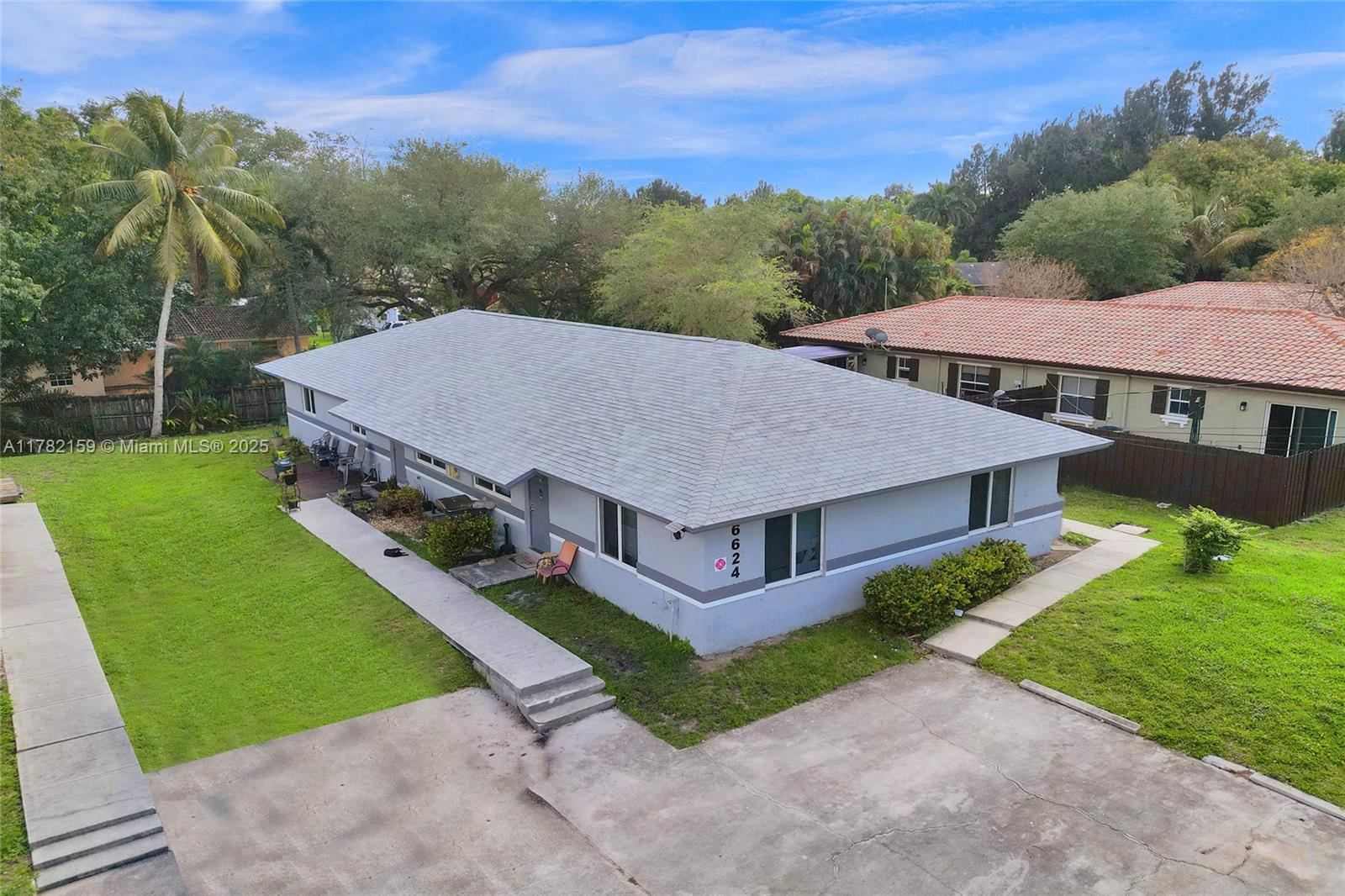 EXCELLENT OPPORTUNITY FOR INVESTORS!! This spacious duplex with extra studio is in a prime location, located near universities, shopping, Seminole Hard Rock Hotel and highways. NEW ROOF AND IMPACT WINDOWS ALL AROUND - 2021/2022. Property features NEW CENTRAL A/C systems, UPDATED KITCHENS with QUARTZ COUNTERTOP in efficiency, 2 UPDATED BATHS, TANKLESS WATER HEATERS, and TILE THROUGHOUT each unit. Shared coin operated LAUNDRY ROOM with security lock. 4 parking spaces. Being sold simultaneously with the building next door, which has the same floorplan/layout - MLS # A11782157.