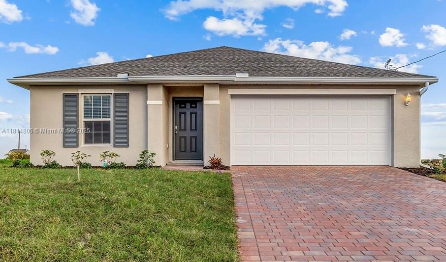 one-story single-family home in LaBelle, FL. This 1,389 sqf home boasts three bedrooms, two baths, and a two-car garage complete with a paver driveway.
The primary suite is nestled at the back of the home and features an en suite bath and walk-in closet. Two guest bedrooms share a guest bath and are located on the opposite end of the home from the primary suite at the front of the home to create a distinct and private retreat.
The well-appointed kitchen overlooks the spacious great room which provides the perfect spot for entertaining family and friends. Featuring modern touches throughout, the kitchen includes a peninsula perfect for bar-style eating, stainless steel appliances, shaker-style cabinets, and quartz countertops.
