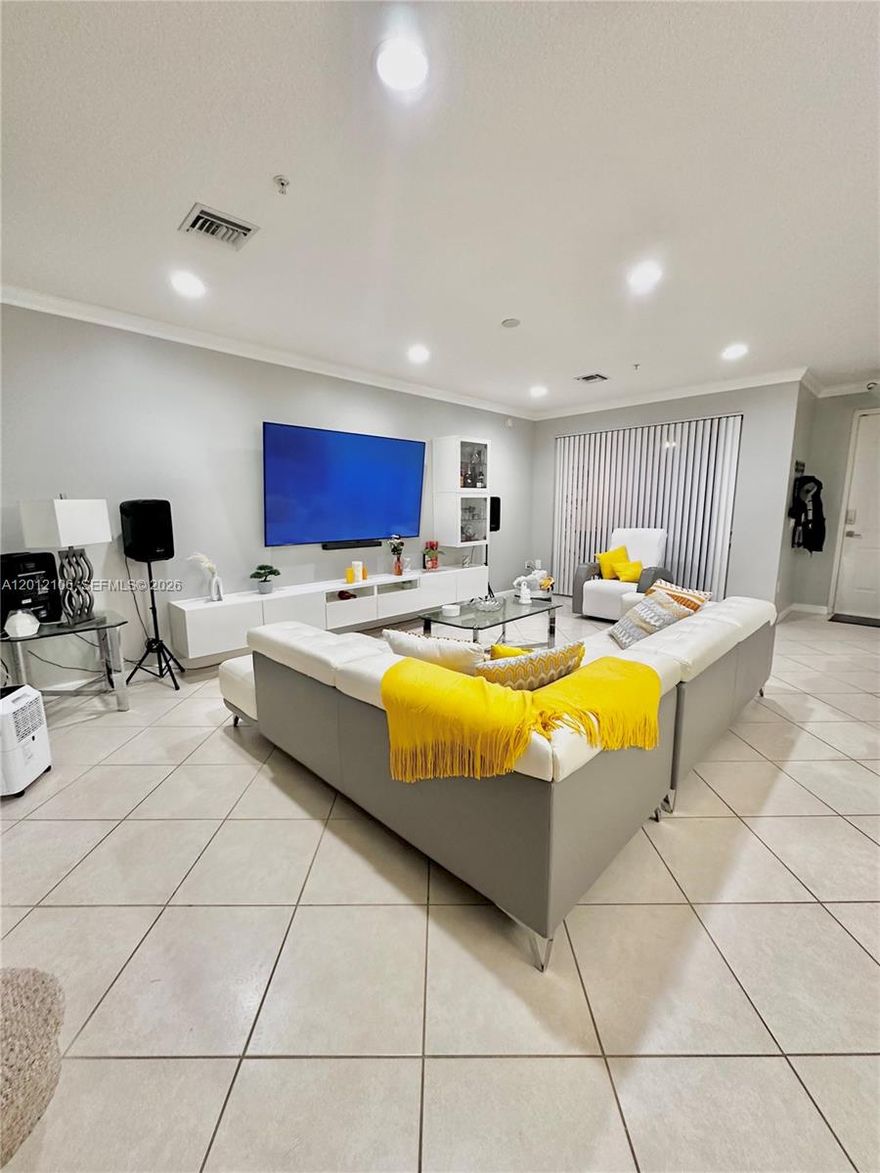 Beautiful and spacious 2-bedroom + den, 2.5-bath first-floor condo located in the highly desirable Artesia community. This well-maintained unit offers a functional and open layout with an updated kitchen featuring granite countertops and stainless steel appliances.

Enjoy the convenience of direct access from your private garage into the home, making daily living effortless. The unit offers generous living and dining areas, perfect for both relaxing and entertaining, along with a versatile den ideal for a home office or additional living space.

The primary suite includes dual sinks and a separate shower and tub, while impact windows provide added comfort and security.

Artesia is a luxury, resort-style gated community offering top-tier amenities including multiple pools, fitness center, tennis courts, basketball court, clubhouse, and 24-hour security.

Prime location across from Sawgrass Mills Mall, with easy access to major highways, dining, and entertainment.