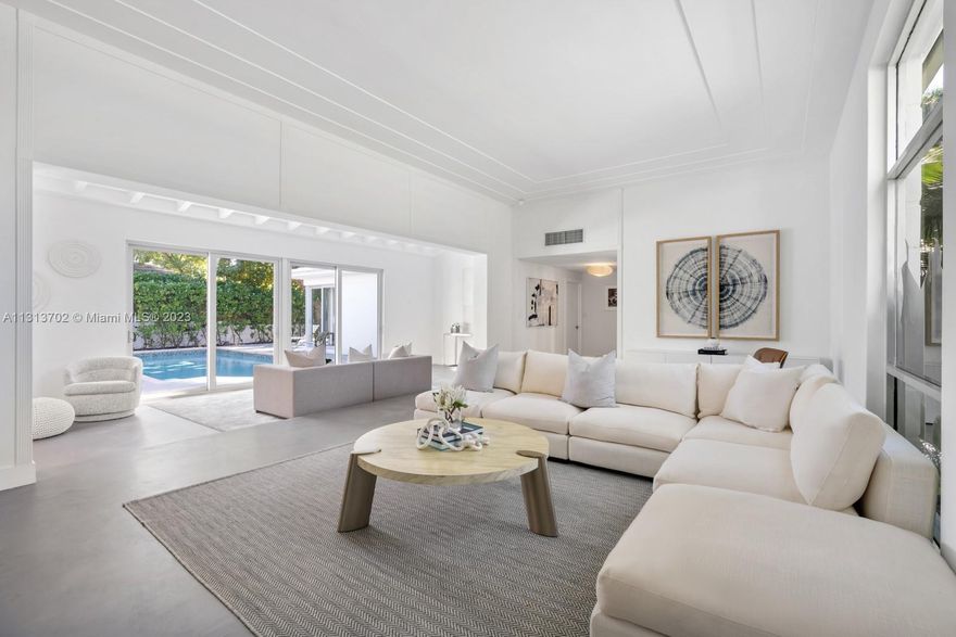 Step Inside with Me! Into this beautifully updated modern bungalow on The Venetian Islands. Facing west on an oversized 11,250 SF corner lot, this single-story island home offers 4 beds and 4 baths with over 3,700+ SF of interiors. Inside you are welcomed through the home’s foyer to two grand living areas, a designated dining space, and contemporary kitchen offering lovely views of the home’s outdoor pool area. Most notably the home’s backyard is the perfect place for entertaining with a large pool, ample patio space, and courtyard with a private entrance. The converted garage provides additional multipurpose space ready for your designer’s touch. Dilido is the premier Venetian Island with highly coveted proximity to Sunset Harbour and Downtown Miami.