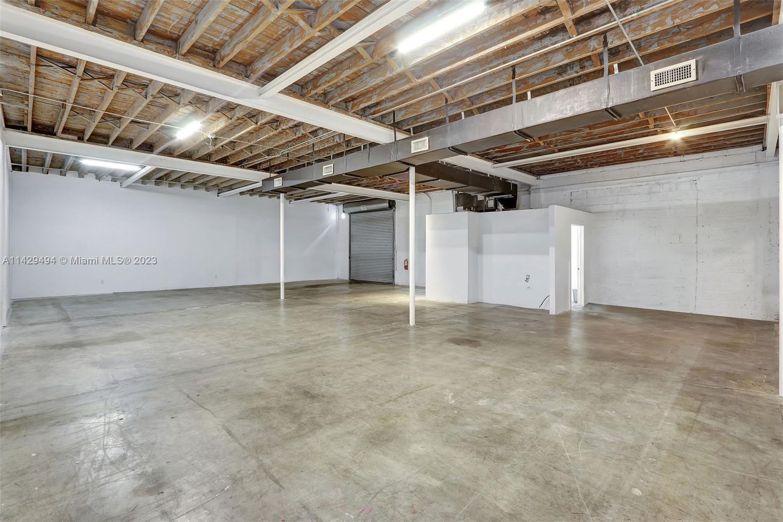 This 2,416 square foot warehouse space is located in the heart of Miami's Little River neighborhood, a rapidly changing and up-and-coming area. The property is situated on a corner lot with excellent visibility and access to major roadways and adjacent to an underpass with lots of parking availability.
The available warehouse space features 12.5 foot ceilings, a ground level bay door, two bathrooms, HVAC, concrete floors, and three-phase power. This is a great opportunity to lease a well-located and well-maintained warehouse in a vibrant and growing neighborhood.