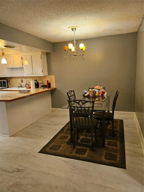 Photo of 43 Spinning Wheel Ln #43, Tamarac, FL 33319 (MLS # A11923969)