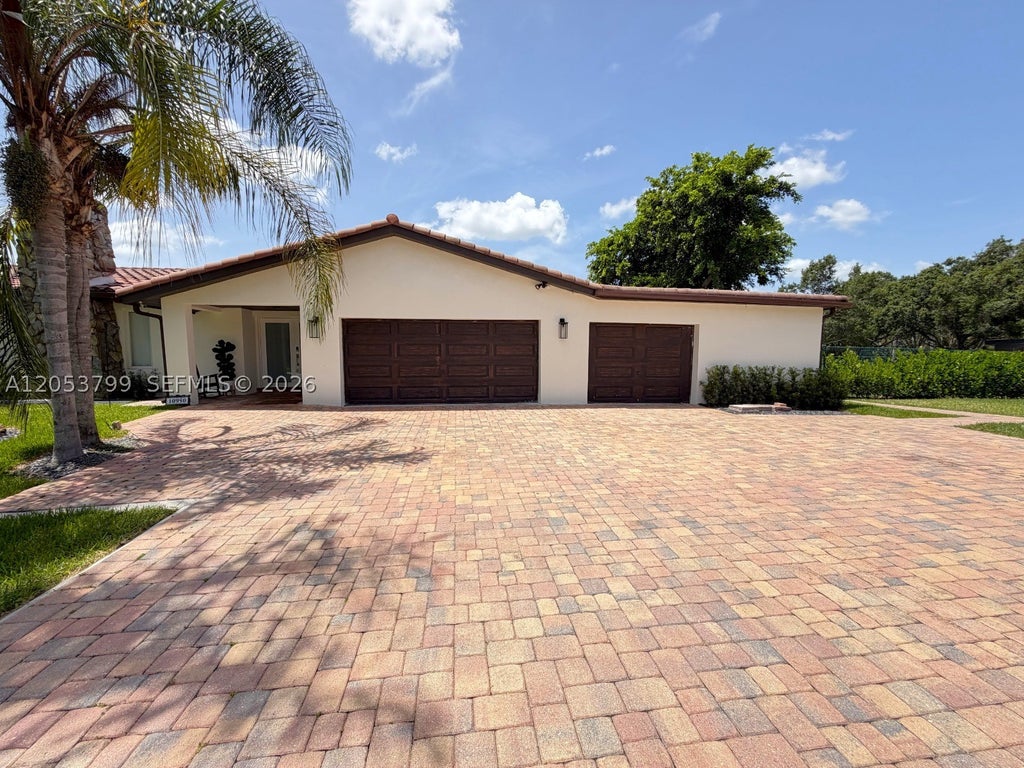 Photo of 10950 SW 40th Ct, Davie, FL 33328 (MLS # A12053799)