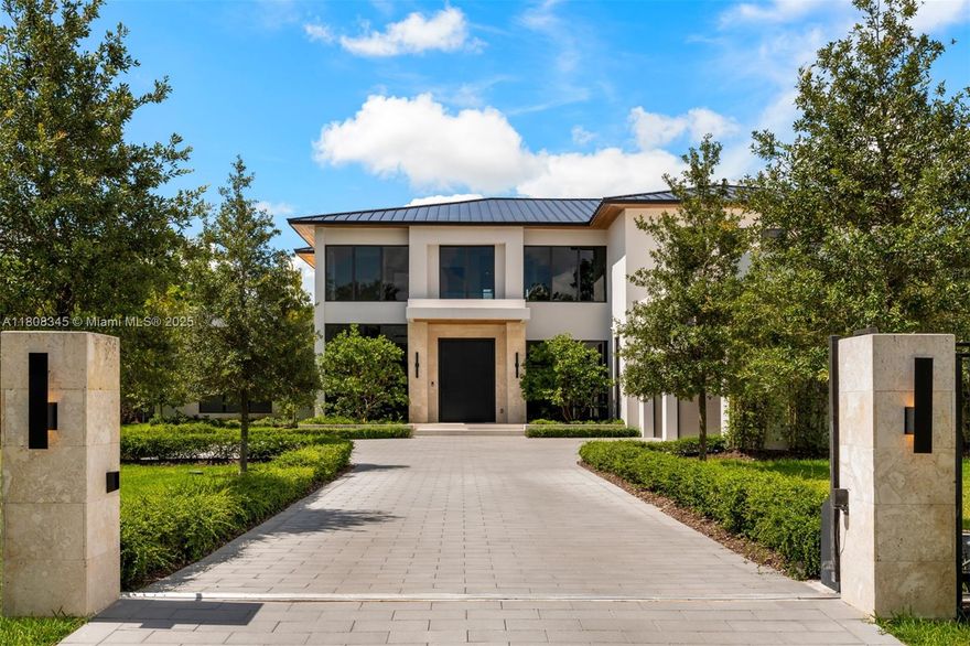 Step into this transitional contemporary masterpiece located in Pinecrest. This home features 7 BD, 8.5 BA, & impressive double-height ceilings. The layout is both elegant & functional, showcasing a stylish clubroom, a formal dining room with a full bar, and a state-of-the-art kitchen. Versatile spaces such as a media room & a private office. The primary suite offers a serene escape with a private terrace and resort style bathroom. Outside, you'll find a pool & a 3-car garage, prepped for a lift installation. A separate 1 BD, 1 BA guest house offers extra privacy & convenience. The property also includes a fully equipped generator & elevator readiness.