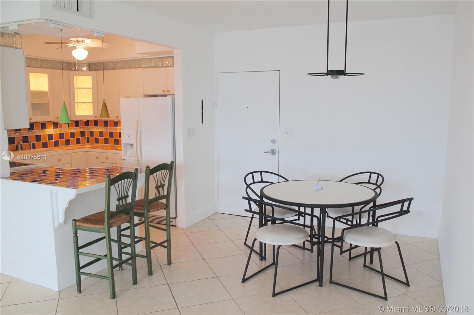 One of the few units in the building with balcony! South East exposure with beautiful views of the pool and canal. 2 bedrooms 2 full baths Corner Unit. Open Kitchen. Tile Floor. Walking Distance To The Beach, Shops And Restaurants. 24 Hour Security, Pool, Gym, Laundry Room, Bike Room Etc. 1 Assigned Parking Space. Easy To Show!.