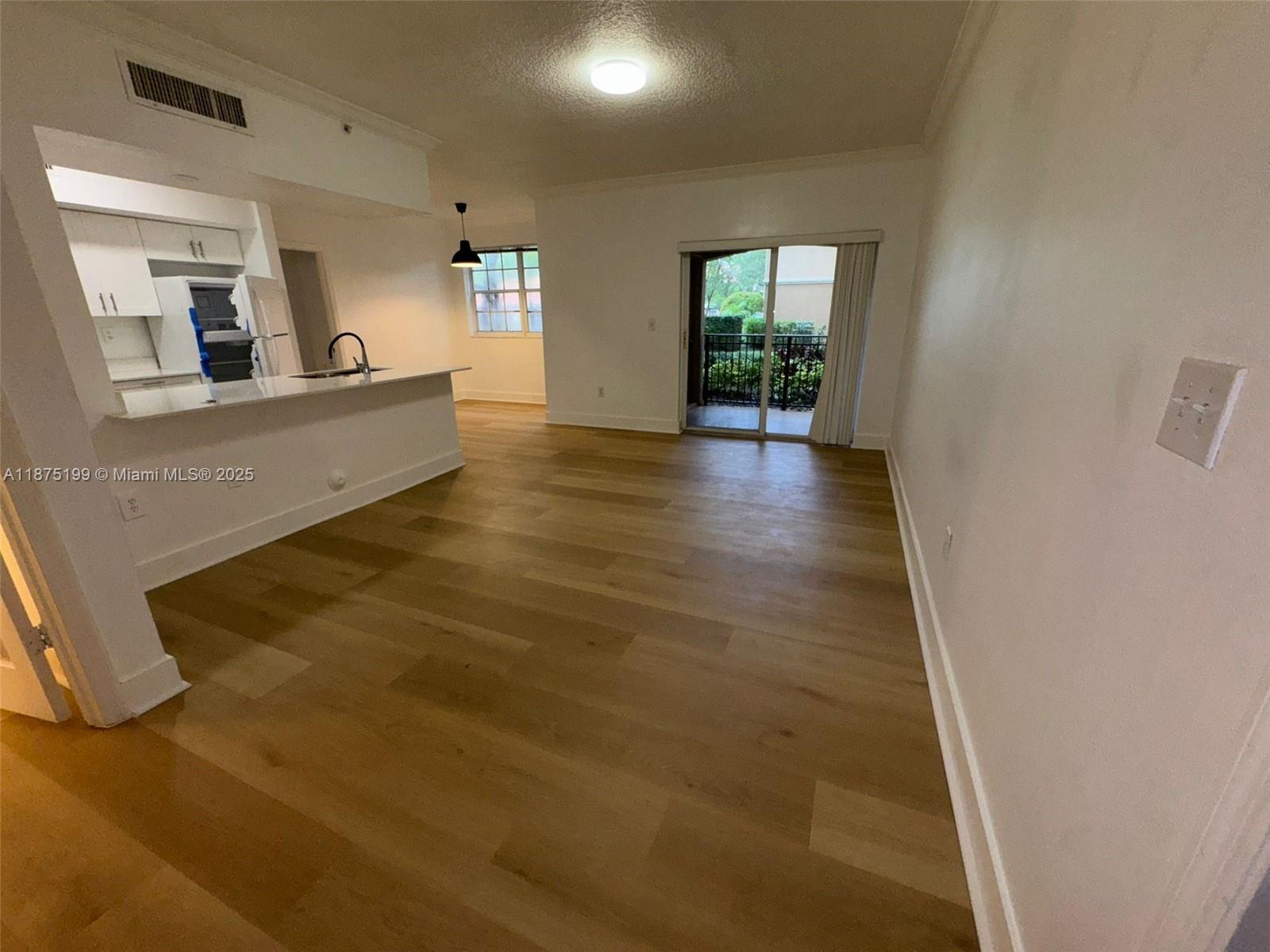 Beautiful and bright 1-bed/1-bath apartment in the heart of Pembroke Pines. Spacious layout renovating floors, updated kitchen, dryer/washer in unit, and private balcony. Community features resort-style pool, fitness center, squash courts, theater, clubhouse, and secure gated entry. Excellent location Across from the Pembroke Pines Mall and next to the Pembroke Lakes Mall, Trader Joe's, restaurants, shops, major highways, and A-rated schools.