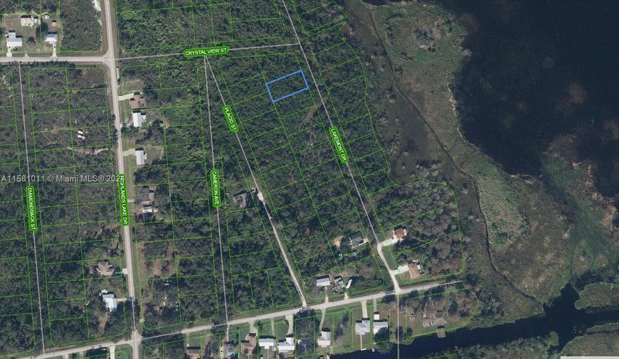 VACANT RESIDENTIAL LOT LAND-   PLUSH GREEN LANDSCAPE LOCATED JUST OFF LAKE PLACID AND BOAT DOCKS.  BUILD YOUR FUTURE NEW RESIDENTIAL HOME OR INVESTMENT LAND.