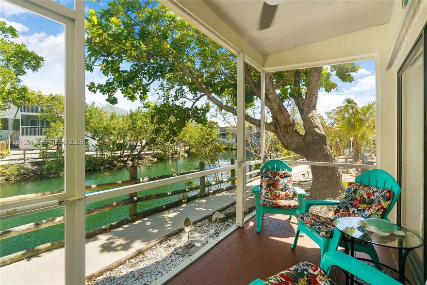 Ready to go rental unit! Nightly rentals are permitted. New furniture, newer appliances, ready for your renters. Step into the kitchen, a culinary haven boasting modern appliances, sleek granite countertops, and a comprehensive array of essentials, ensuring every meal is a delight. The inviting living room offers a comfortable sofa, which effortlessly transforms into additional sleeping space, accommodating even more guests. This unit has everything you need to be a successful investment property. 3 covered patios, open upper deck to watch the sunset. This unit is located on the swimming lagoon with a beach. Enjoy the community pools, tennis courts, playground and a marina with a boat ramp. There is also room for boat trailer storage. This is a gated community with 24-hour security. You can reach several local restaurants by golf cart with never driving on US1. Key Largo Park is also an easy golf cart ride away, play pickle ball, tennis or enjoy the kid's area. This unit has everything you need to use for your own enjoyment and generate an income when you are not using it.