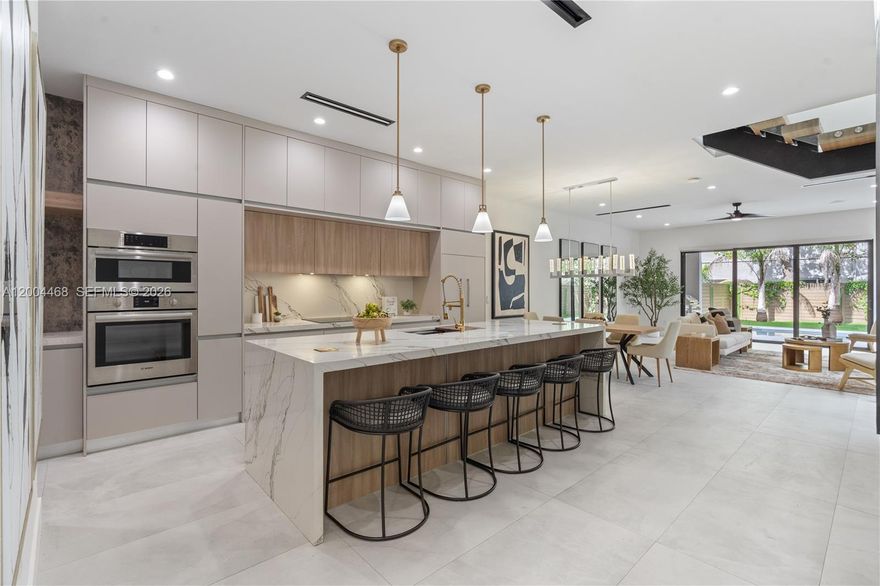 Modern newer construction in the heart of Victoria Park, offering a rare blend of design, comfort, and location. This move-in ready 4-bedroom, 3.5-bath residence spans 3,074 total square feet and showcases refined finishes and thoughtful craftsmanship throughout. From the moment you enter, soaring 14-foot ceilings and a striking glass staircase create an immediate sense of scale and sophistication. Custom lighting, open floor plan, and curated window treatments elevate every space with a clean, modern aesthetic. The chef’s kitchen is designed for both everyday living and entertaining, featuring a Fisher & Paykel refrigerator, Bosch appliances, custom-cut waterfall countertops, and a sleek wet bar that seamlessly connects the living areas. Outdoor living is just as impressive, with a private patio and a beautifully landscaped retreat centered around a pool. A fully equipped summer kitchen with built-in BBQ, sink, and beverage fridge creates the perfect setting for entertaining year-round. Additional highlights include a 1-car garage and parking for two more vehicles in the driveway. Ideally positioned in one of Fort Lauderdale’s most desirable and secure neighborhoods, just steps from Holiday Park and Panthers IceDen, and minutes from Las Olas Boulevard, fine dining, shopping, and the beach. This home offers the ultimate blend of privacy, convenience, and lifestyle.