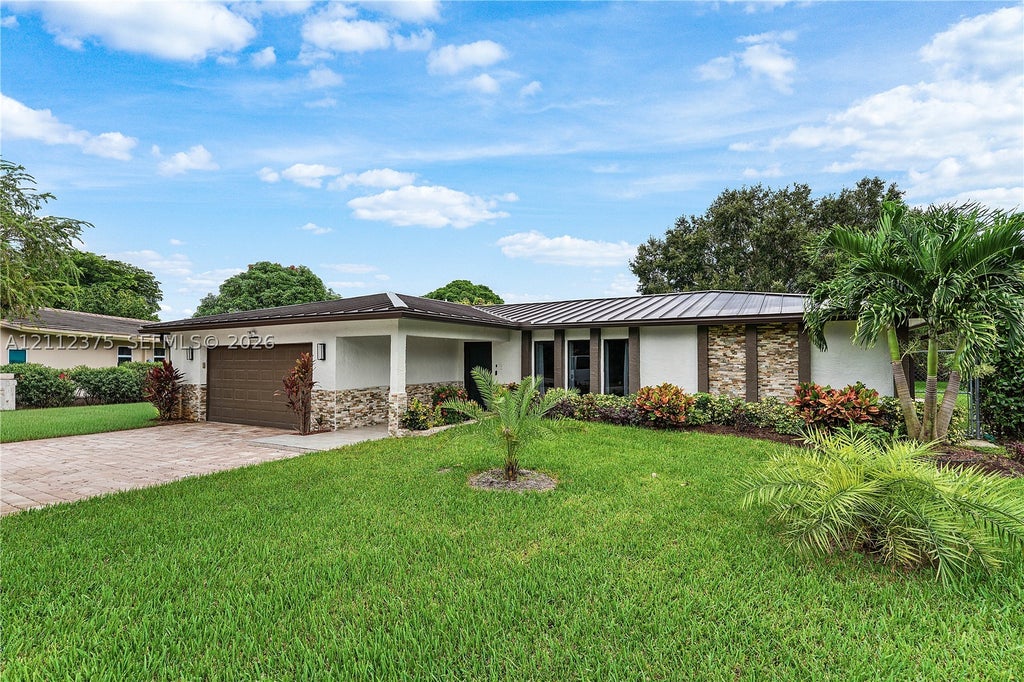 Photo of 10936 NW 41st Dr, Coral Springs, FL 33065 (MLS # A12112375)
