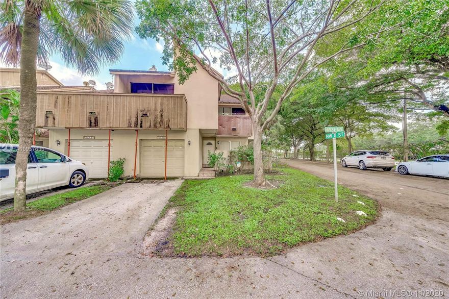 BEST OPPORTUNITY to own a 4 bedroom/ 3 bathroom plus bonus room home with over 2000 square feet in Plantation. Priced to sell, this home has been tastefully updated to include quartz countertops, stainless steel appliances, and real hardwood floors.  With interest rates as low as they are, you can likely own for less than $2k a month ALL IN!  The seller has already paid off more than half the special assessment and soon this property will be getting its new roof and impact windows and doors.  Special Assessment will expire in April of 2021!  This will sell fast! All ages welcome and pet friendly.