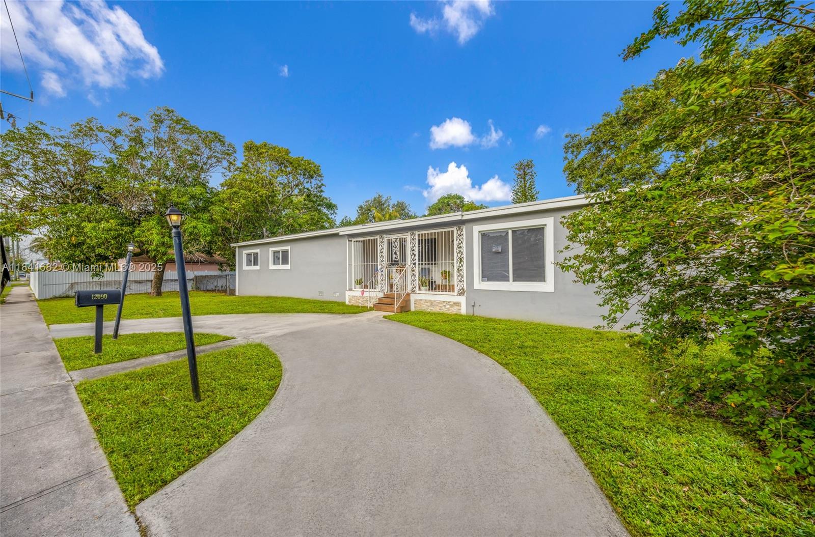Outstanding opportunity in Sunkist Grove! This spacious 4bed/3bath, 2,386 sq ft one-story home on a generous 10,094 sq ft lot. Property offers open-plan living with a family room, Florida room and laundry/utility space. New wood vinyl, tile, carpet & marble flooring throughout, central A/C, electric heat and full impact glass. NEW ROOF 3 years ago. Exterior includes a circular driveway, carport and open porch.House is a solid concrete-block construction ensures durability. Nestled in a quiet neighborhood just minutes from I-95, there are beautiful square parks thought out the neighborhood and top amenities. Perfect blend of size, character and potential!