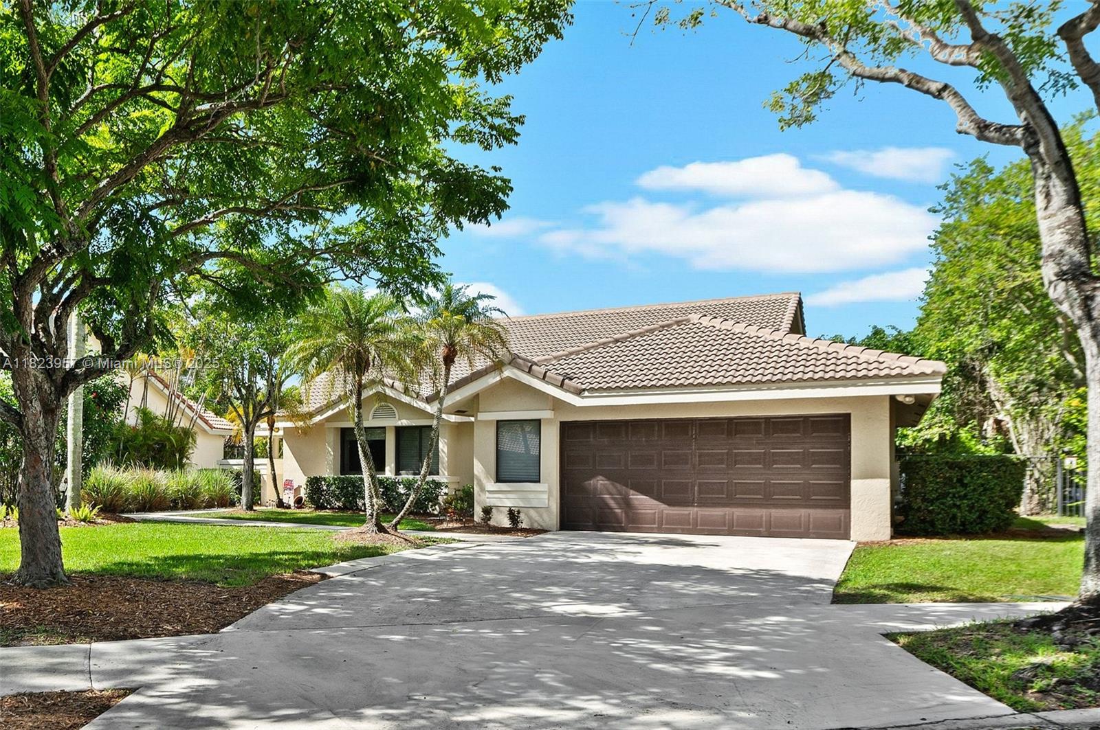 Welcome to this nicely maintained single-story home on a private cul-de-sac in The Oaks. Enjoy an oversized drive, lush landscaping, and a relaxing pool and patio—ideal for entertaining. The open, sunlit layout features 3 bedrooms, 2 baths, new laminate flooring, a modern kitchen with wood cabinetry and stainless appliances, impact windows/doors, and a separate laundry room. Steps from A-rated schools, parks, and resort-style amenities. Experience the best of Weston living—your perfect retreat awaits!