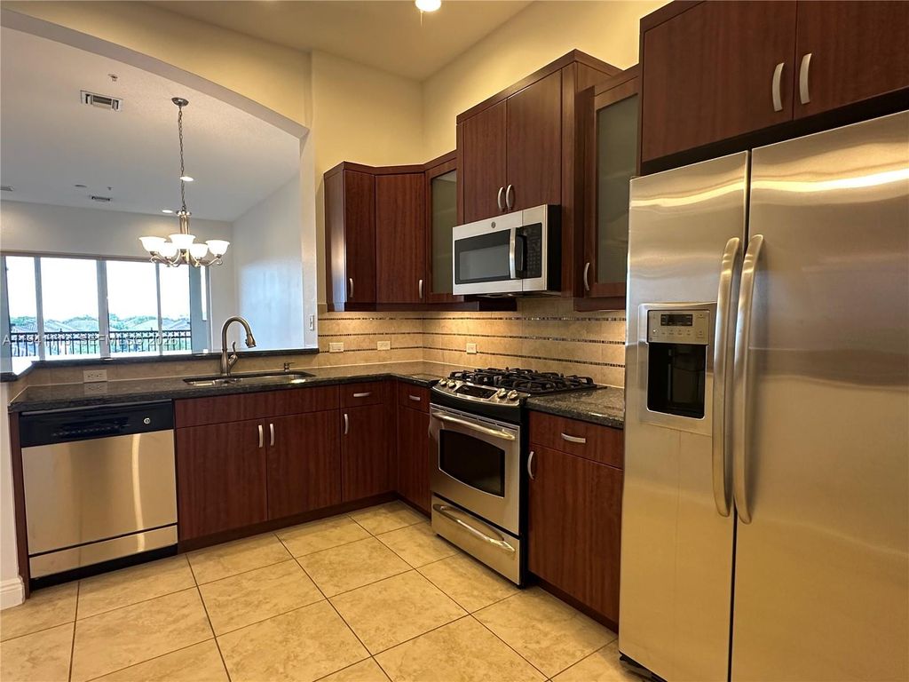 Photo of 3055 NW 126th Ave #411, Sunrise, FL 33323 (MLS # A11941113)