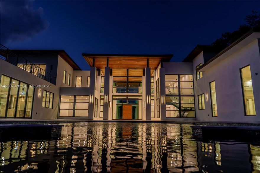 An exceptionally elegant villa situated on over an acre-size corner lot in the prestigious east side of Pinecrest, one of Miami’s most sought-after neighborhoods, renowned for its privacy, lush surroundings, and top-rated schools.https://youtu.be/A4CXSjQTMuY
The home offers a total of 15,007 square feet, with 11,670 square feet under air conditioning. The interior features eight spacious bedrooms, a media room, ten full bathrooms, and two powder rooms, all thoughtfully designed for maximum comfort and convenience.

The outdoor space is equally impressive, featuring a 50-foot resort-style pool with a beach entry, an integrated Jacuzzi, a fully equipped outdoor kitchen and a guest house—creating an ideal setting for both relaxation and entertainment.