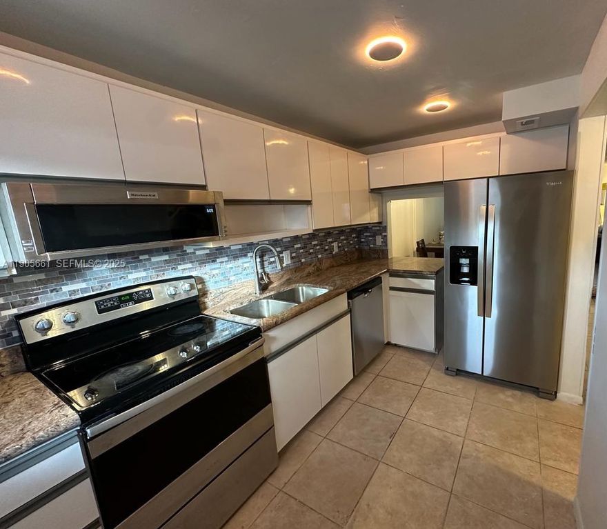 Beautiful first-floor 2 bed / 2 bath condo in highly desirable Lighthouse Point. This updated unit features brand-new A/C, new water heater, and spacious bedrooms, each with its own walk-in closet. Located in a well-maintained community on the canal, offering a peaceful Florida lifestyle just minutes from the beach, dining, and shopping. Unit 102A at 4500 North Federal Highway is move-in ready and perfect as a primary residence or seasonal home.