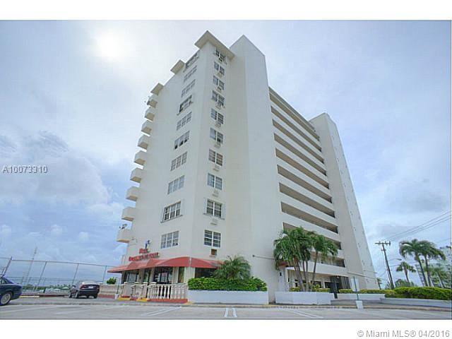 Waterfront Building with Beautiful Sunsets, Pool, Tennis courts & Shops. Apartment is remodeled, includes tile floor throughout in quite street located in North Bay Village.