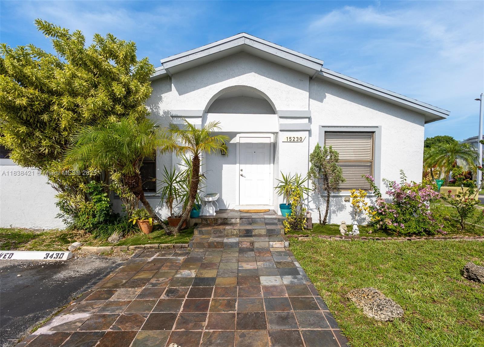Beautifully remodeled 2-bedroom, 2-bath plus a den corner townhouse in highly desirable Westwind Lakes! This one-story villa features an upgraded kitchen with quartz countertops and stainless-steel appliances, laminated floors throughout, impact doors plus shutters for all windows and in-unit washer/dryer. Enjoy a fenced patio, and 2 assigned parking spaces in front of the unit. Community offers a pool and private park. Prime Kendall location near top-rated schools, shopping, restaurants, Publix, Walgreens, Walmart Supercenter and public transportation. Move-in ready and perfectly located!