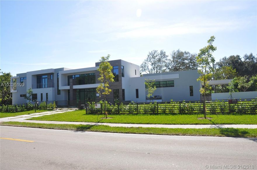 THE MOST SPECTACULAR AND READY TO MOVE IN CONTEMPORARY DESIGN HOME IN PINECREST. IMPRESSIVE facade, SENSATIONAL POOL with wood deck, backyard and 447 Sq Ft SUMMER KITCHEN. 7 bedrooms, 7.5 bathrooms. Italian kitchen by Veneta Cucine, Wolf and Subzero appliances, magnificent pantry. 30"x 60" Italian porcelain, italian wood floors and doors with magnetic door lock-system. Impressive WINE CELLAR. 21"ceiling great room, very bright, all areas with pool view. Game/gym room. Maid quarters. Laundry/storage rooms. Highest quality Impact windows and doors. HIGH TECH House controlled from your cell phone.