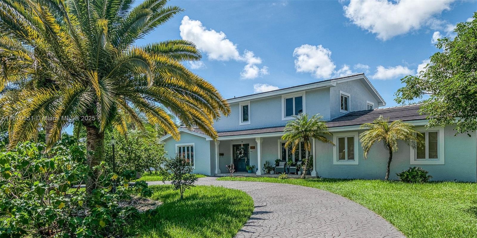 Unique opportunity to own this single family - canal home - on Palmetto Island!! This 5bd/4bth residence offers spacious living with a formal living and dining area, plus cozy family room. The ground floor main bedroom, which leads out to the pool area, features an adjacent bonus room—perfect for a home office, gym, or in-law suite. The upstairs four bedrooms and two full baths feature wood flooring throughout. The modern kitchen features stainless steel appliances and granite countertops. Exit from the pool area into your own private garden/doggy run with canal access and serene water views. With a circular driveway providing ample parking, this home combines comfort and elegance in a desirable "island" location. Will not last!!