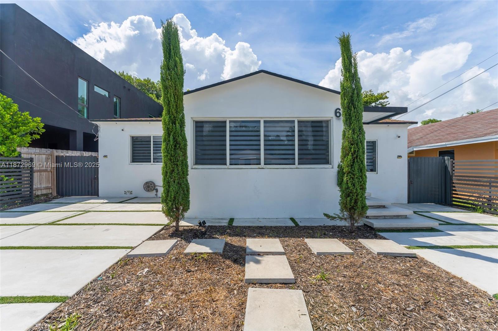 This fully remodeled home is just minutes from the culturally rich Miami Design District, known for its luxury boutiques, art galleries, Michelin-starred restaurants, and high-end shopping experience
Wikipedia. It also offers easy access to Wynwood, Midtown, Downtown, and Brickell—making it ideal for both modern family living and investment appeal. The home features a contemporary open-concept layout with high-end finishes and a sleek kitchen. Each of the three bedrooms includes its own full bathroom. Set on a generous 7,200?sq?ft lot, the home comes with a deck, shed, fruit trees, fenced yard, and room to add a pool, creating an ideal blend of indoor-outdoor lifestyle. Roof is from 2021, Impact Windows and doors.