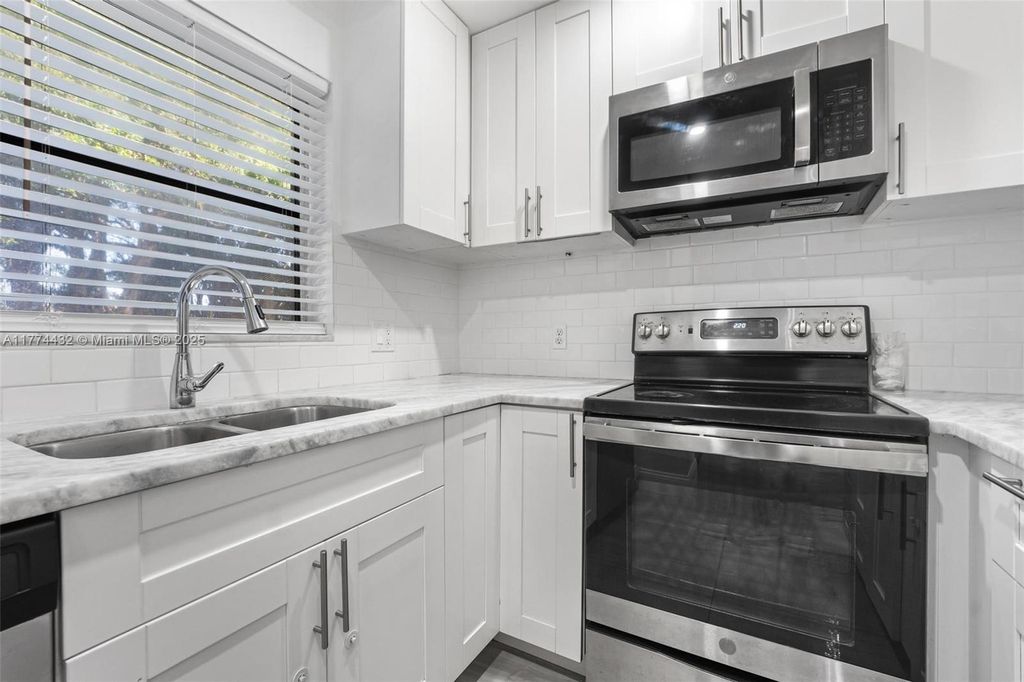 Photo of 3930 Crystal Lake Dr #106, Deerfield Beach, FL 33064 (MLS # A11774432)