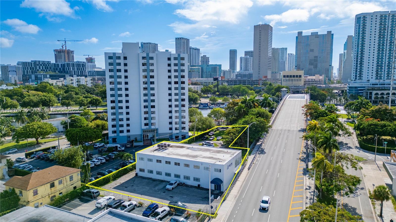 Entire Office Building For Lease. The building is spacious, consisting of two floors. On the first floor, there are 6 offices, 2 large common rooms, 1 large storage space, 2 smaller storage rooms, and 2 bathrooms. On the second floor, there are 8 offices, 2 large common rooms, several storage closets, a kitchen, and 2 bathrooms. Perfect for a business that wants to occupy an entire building.
The building has unique mid-century modern charm, and is filled with natural light. It is turn-key for immediate occupancy by an office user. However, the landlord will also allow appropriate time for a user to renovate the space to their liking.
In addition to the building, an expansive lot is included in the lease price. There is a paved parking lot as well as more land behind the building.