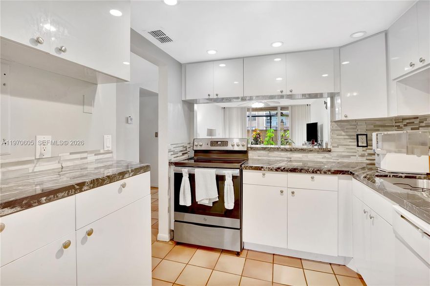 Move-in ready 2BD/2BA first-floor unit in the desirable Gardens of Kendall! This spacious unit features an updated kitchen, newer A/C and water heater, and a private patio perfect for relaxing. Financing friendly  building with full reserves, 40-year certification completed, and NO special assessments — a rare and valuable combination for buyers and lenders. Enjoy resort-style amenities including pool, tennis courts, clubhouse, and on-site laundry. Prime Kendall location directly across from Miami Dade College, with quick access to major highways, shopping, dining, and public transportation.