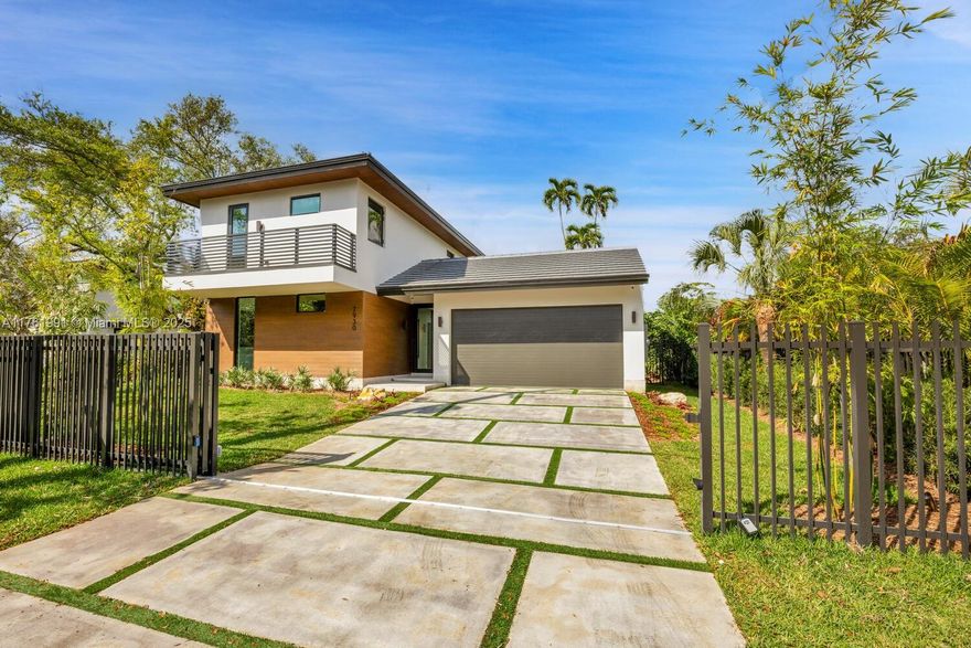 This new construction modern tropical home in South Miami offers 6 bedrooms & 5.5 bathrooms, blending natural materials w/a sleek, contemporary design. Thoughtfully crafted with water features, wooden accents, & rock elements, the home is filled w/natural light through expansive windows. Inside, the first level features 24x48 Sandstone Silk White porcelain flooring, while the second level boasts rich wood flooring. The MiaCucina kitchen is outfitted with quartz Calacatta Ocean Gold countertops & premium Thermador appliances. The primary suite includes a beverage center & LED-lit MiaCucina closets. The outdoor area is designed for relaxation &entertaining, with a modern pool, cabana bath, & summer kitchen. Additional features: a Control 4 smart system, electric curtains, 2-car garage.