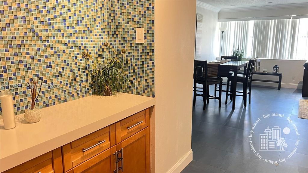 Photo of 401 Golden Isles Dr #101, Hallandale Beach, FL 33009 (MLS # A11993255)