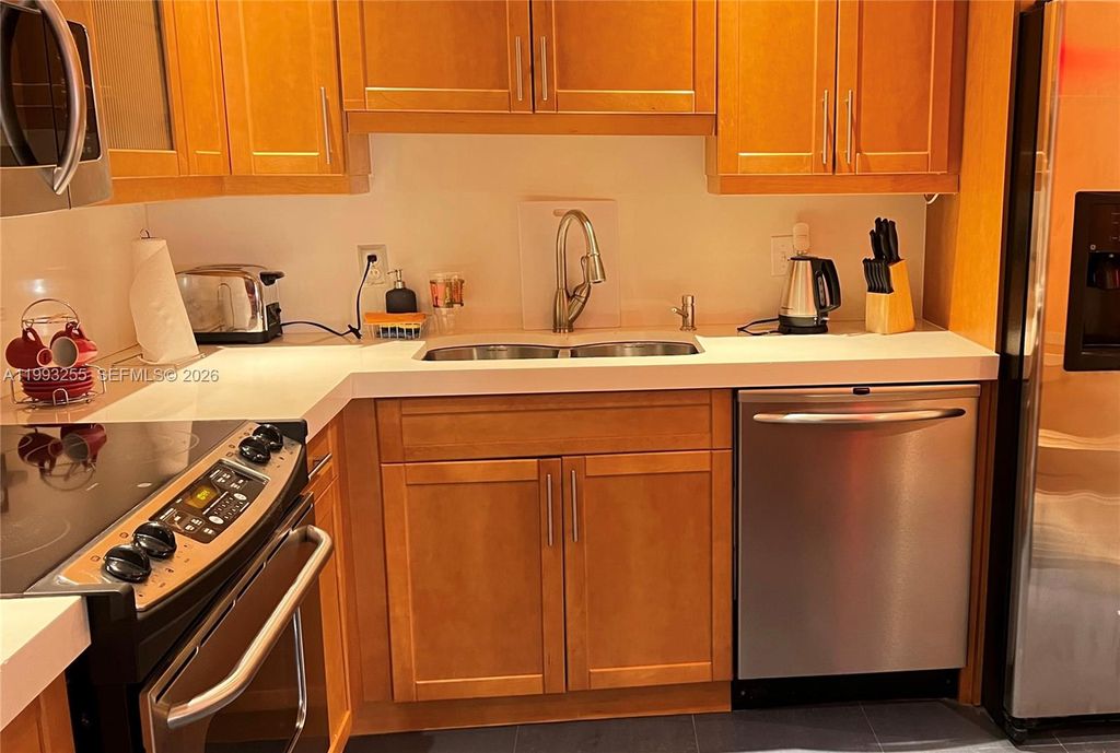 Photo of 401 Golden Isles Dr #101, Hallandale Beach, FL 33009 (MLS # A11993255)