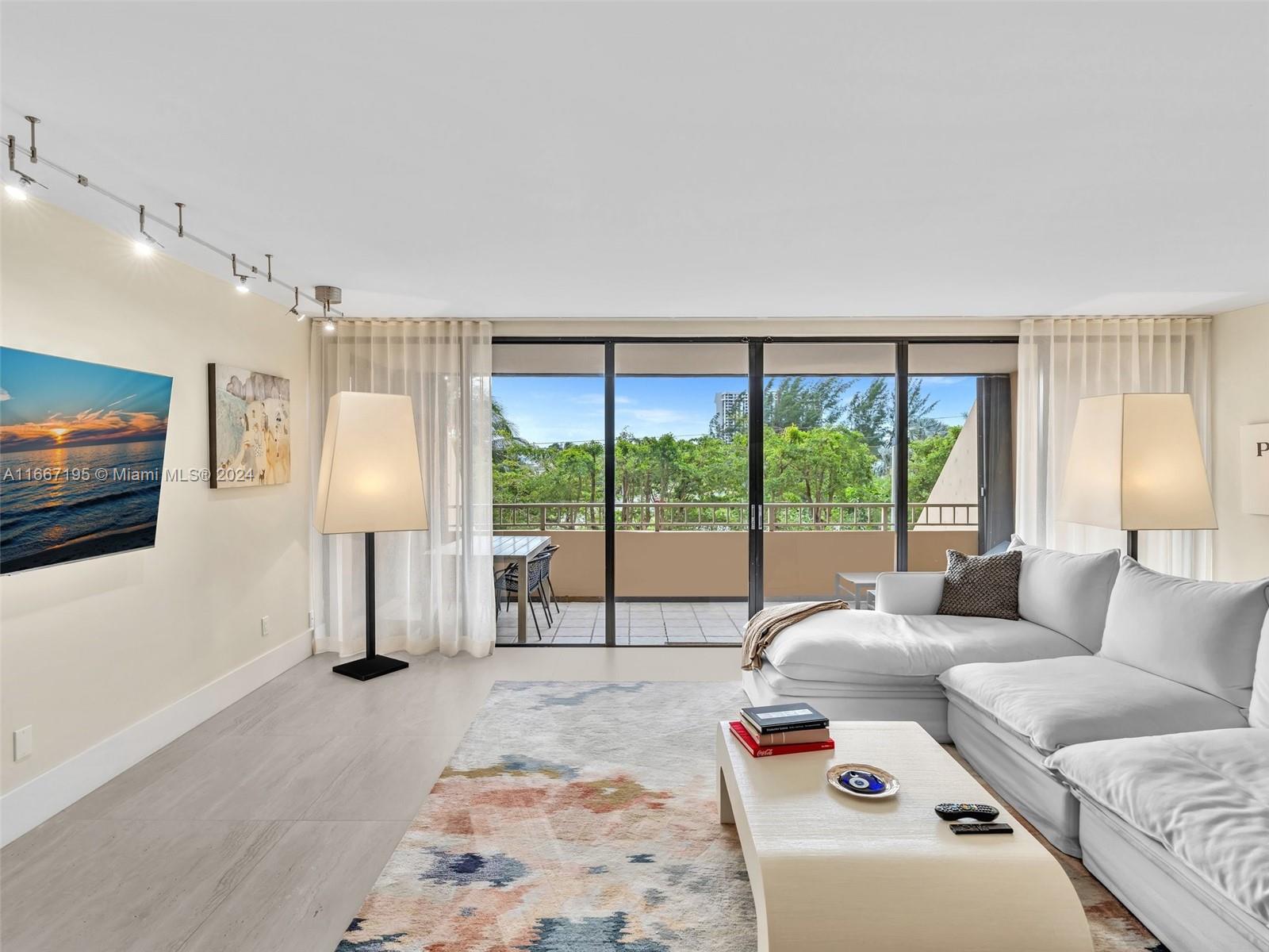 Stunning, completely renovated masterpiece that shows like a model. No expense spared in improvements. This spacious 2 Bedroom/ 2 Bathroom South East Bay view unit features an open designer-kitchen with granite countertops and waterfall edge, Stainless Steel appliances, an oversized master bedroom in a split floor plan with new bathrooms, huge walk in closets and black out shades. Bonus room/home office. Unit available furnished or unfurnished. In unit laundry room with washer/dryer. This is possibly the most beautifully renovated unit at the Jockey Club right now. The building has undergone extensive renovations. It includes a new gym, new hallways, new lobby,24 hour security, pool, sauna, Jacuzzi and many other improvements. Minutes to the design district. Easy to show.