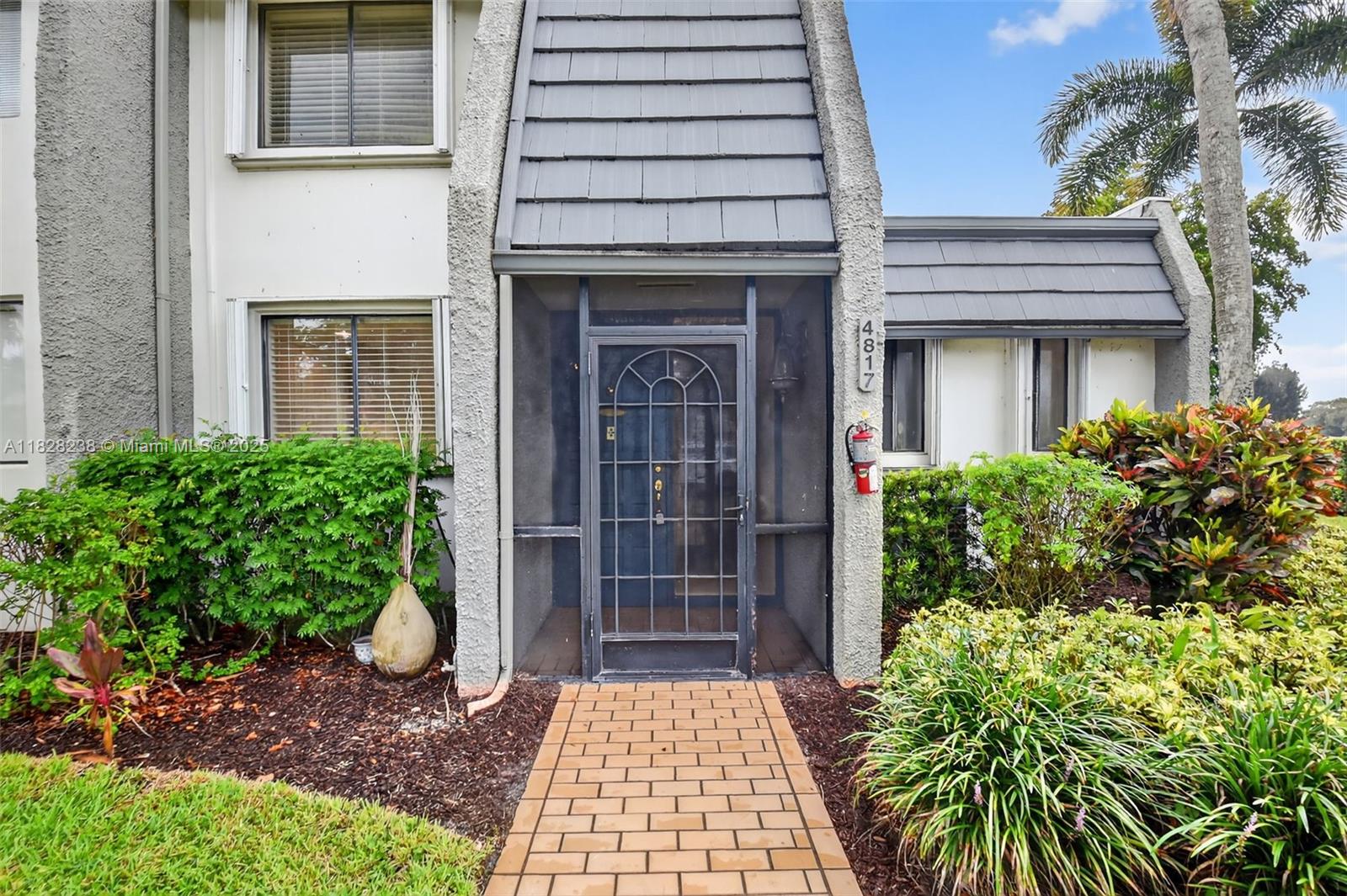 Spacious and bright 3BR/2.5BA townhouse in the gated Fountains Country Club community. The first floor features an eat-in kitchen, open living/dining area, expansive Florida room with floor to ceiling glass perfect for relaxing or working, and a primary suite with walk-in closet and en suite bath, plus a half bath. Upstairs offers two large bedrooms, full bath, and in-unit laundry. Neutral tones throughout. Just steps to the community clubhouse and pool. HOA includes cable, internet, landscaping, exterior maintenance, and Esedra community amenities. Optional Fountains CC membership available but not mandatory or required
