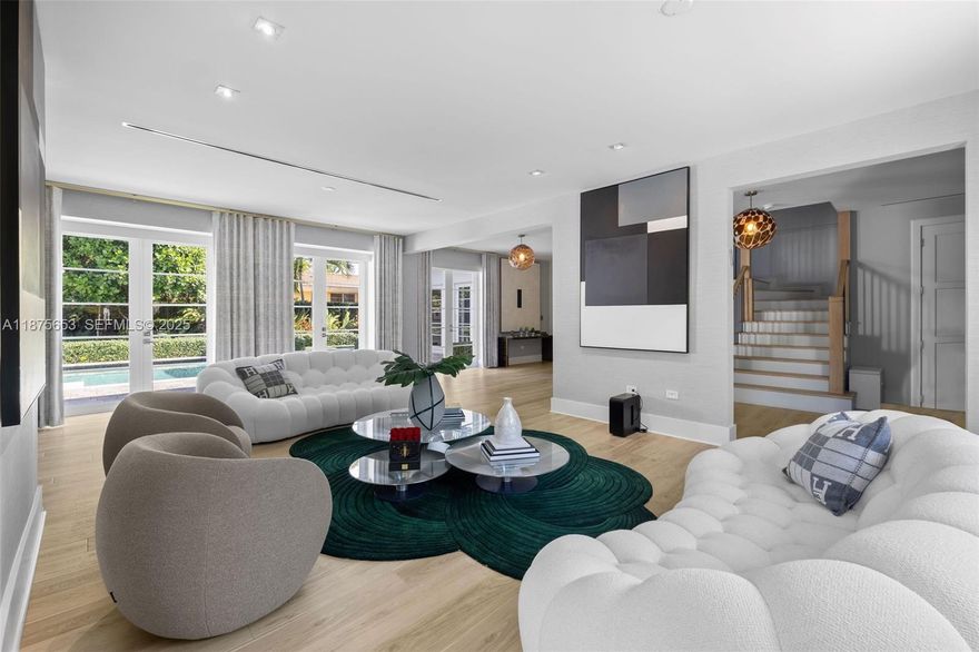 This luxurious Miami Beach estate presents a seamless blend of grandeur and chateau elegance. With 6 beds and 6.5 baths, the open-plan kitchen boasts high-end finishes and top-of-the-line Wolf, Miele, and Subzero appliances. Just steps from the kitchen is a spacious dining area and a relaxing family room. The exquisite master bedroom serves as a private retreat unto itself, featuring a sitting area overlooking the pool and patio. A chic office space, doubling as an ensuite bedroom, offers versatility and convenience. The guest suite impresses with a kitchenette, living area, and stunning lush outdoor views. Conveniently located near upscale restaurants and shops, and a short distance from the ocean, this residence embodies the ultimate Miami Beach lifestyle.