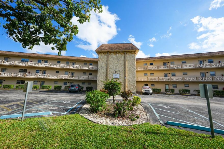 Immaculately maintained first-floor 1-bedroom condo with versatile extra room (ideal for den, hobbies, or office) featuring peaceful lagoon views through windows. Fully furnished & stocked—truly turnkey; just bring your suitcase! Located at 4700 NW 35th St, Lauderhill, FL, in a quiet 55+ community with welcoming tropical vibes.
Super convenient: ~20 steps to laundry room & mailboxes; your assigned parking spot directly in front + plenty of visitor parking. Step out to lush grounds with blooming hibiscus, charming walkway bridges over lagoons, and a refreshing heated pool for year-round enjoyment.
Low monthly maintenance fee covers water, cable, and more—keeping expenses predictable. Association requires no minimum down payment and the unit qualifies for easy financing—making this a smart, accessible opportunity. Don't wait—schedule your private tour today and envision relaxed Florida living!