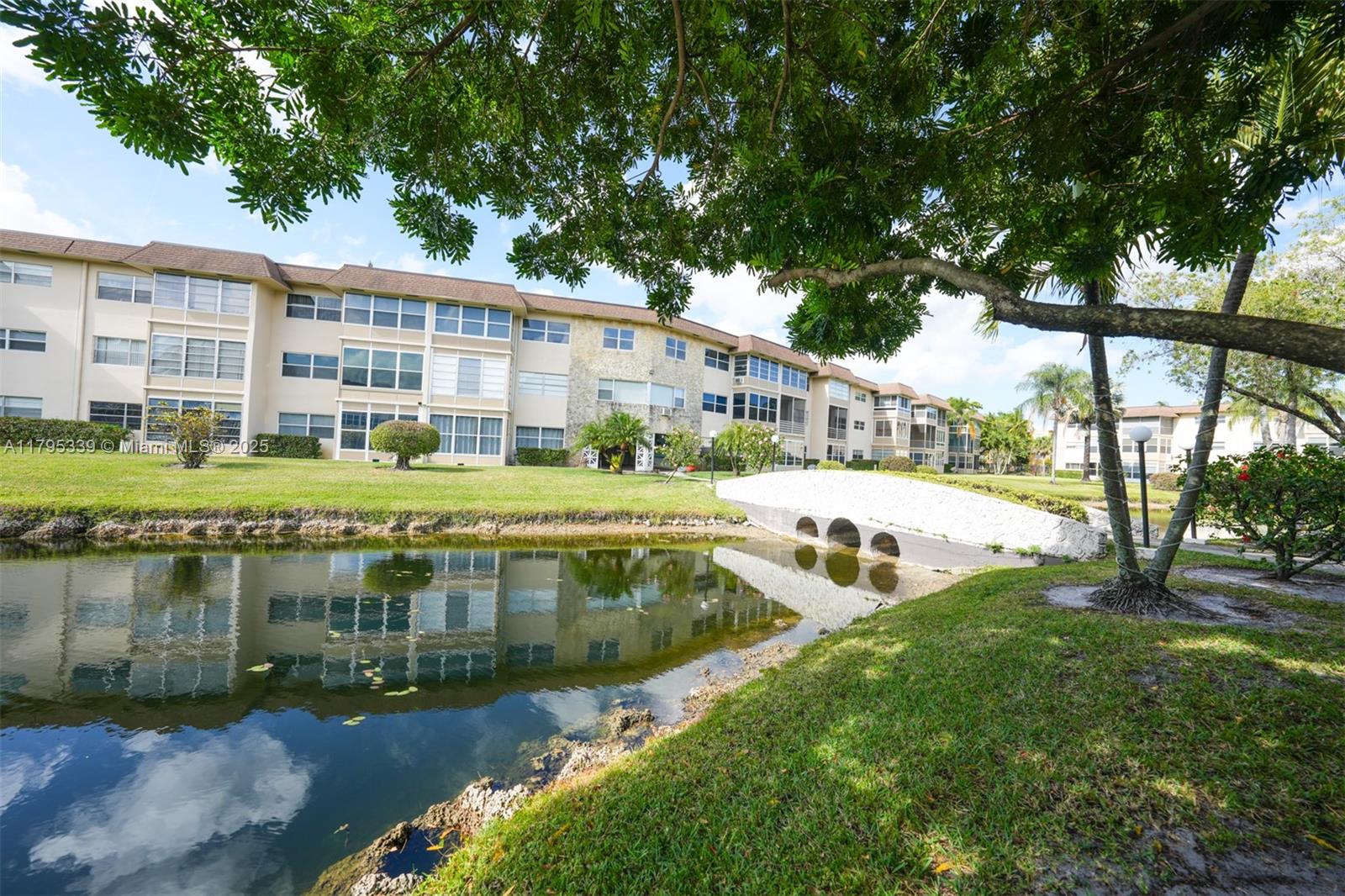 Discover the charm of Unit 408—a lovingly cared-for condo nestled on the first floor of a quiet, predominantly seasonal 55+ community. Just bring your suitcase! This unit is fully stocked and move-in ready. Features a Florida room overlooking a serene lagoon, is perfect as a reading room, hobby space, or even a guest sleeping nook. Steps from laundry, mailboxes, and your assigned parking space, with plenty of guest parking nearby. Enjoy blooming hibiscus trees and picturesque walkway bridges that lead to the heated pool. Low maintenance fee covers water and cable. Great for snowbirds looking to enjoy the sunshine without the stress. Whether you're a snowbird or settling in full-time, this cozy corner unit checks all the right boxes.